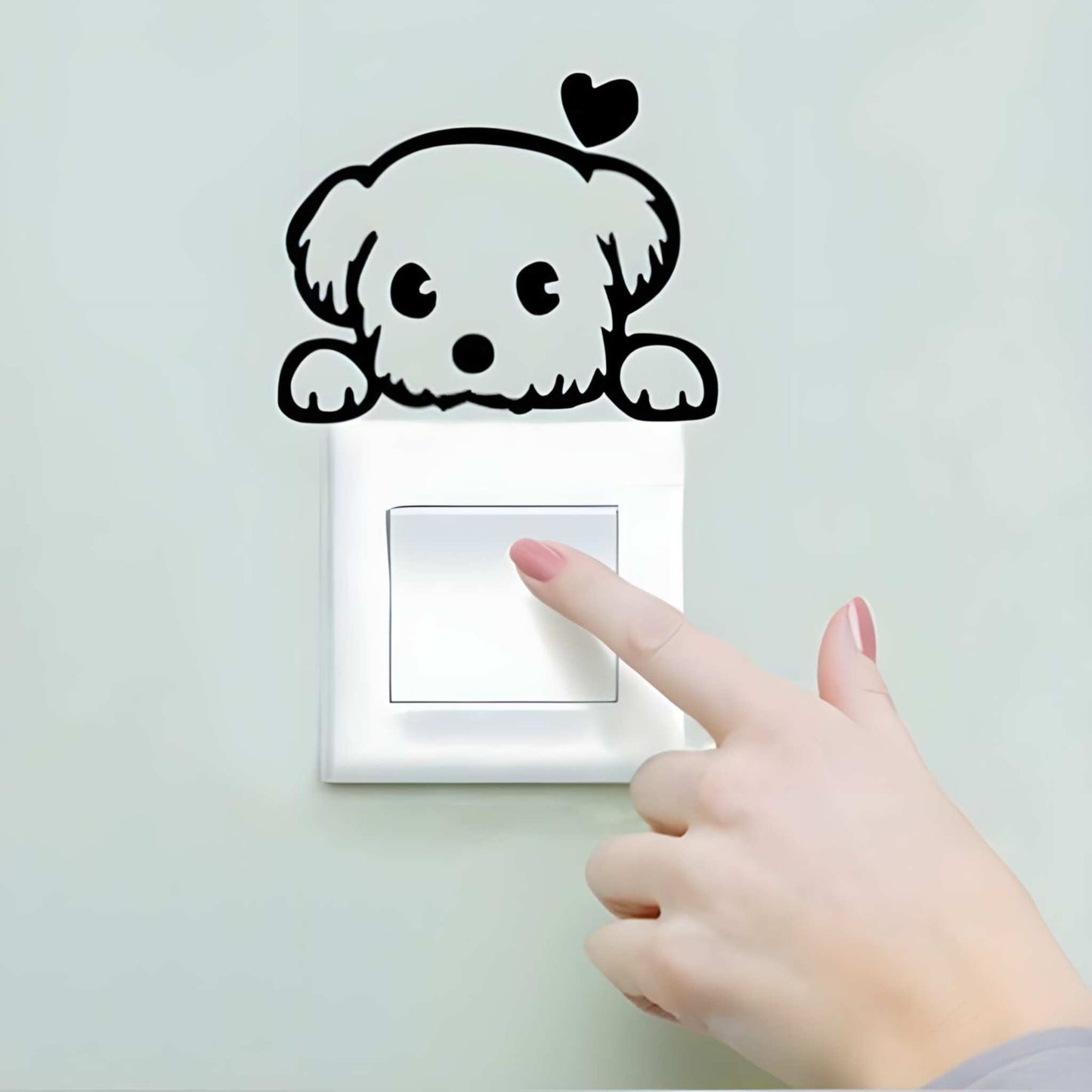 Sticker decorativ pentru intrerupator cu catelus de 9x7 cm, din autocoland oracal negru, usor de aplicat.