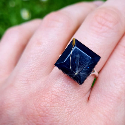 Silver ring and epoxy resin, with dandelion fluff
